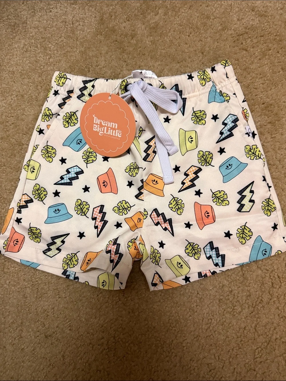 Dream Big Little Girls' White Swim Trunks with Colorful Print
